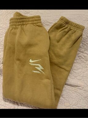 Nike Kids Tan Sweatpants with White Swoosh Accent